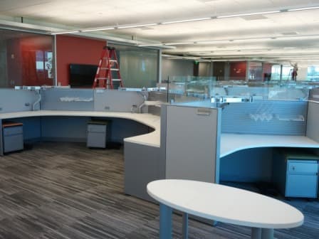 Commercial office furniture installation — curved workstation project by MIS