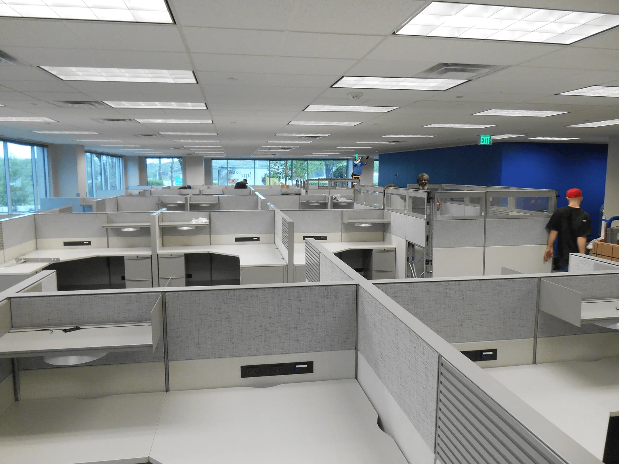 MIS team installing commercial cubicle workstations in large open office